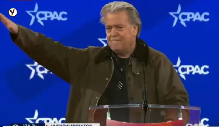 Steve Bannon speaking at CPAC with a controversial gesture causing outrage.